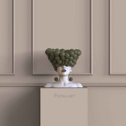 Scultura d’arredo di lusso con busto femminile verde oliva per un interno contemporaneo.