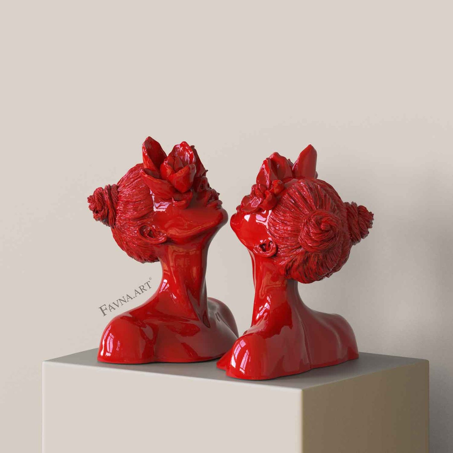 Striking and faun-inspired female  sculptures of stylized young faces in red color "Daughter of Faunus" as modern statue art by "Favna.ART"