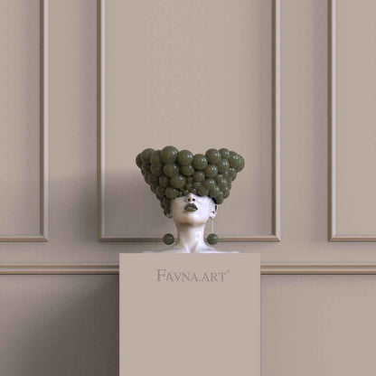 Luxury statement sculpture with an olive green female bust design for a contemporary home interior.