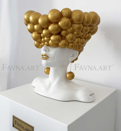 Sculpture of a woman "Thoughts" gold