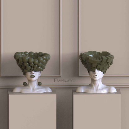 Contemporary sculpture set with male and female busts, glossy geometric elements and matching statement details by FAVNA.ART.
