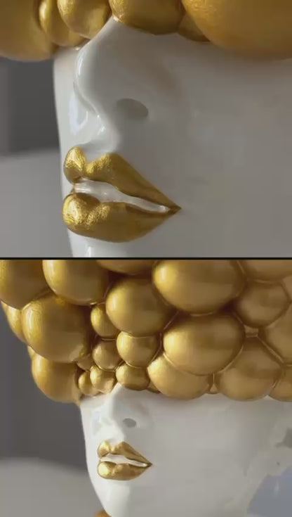 Sculpture of a woman "Thoughts" gold